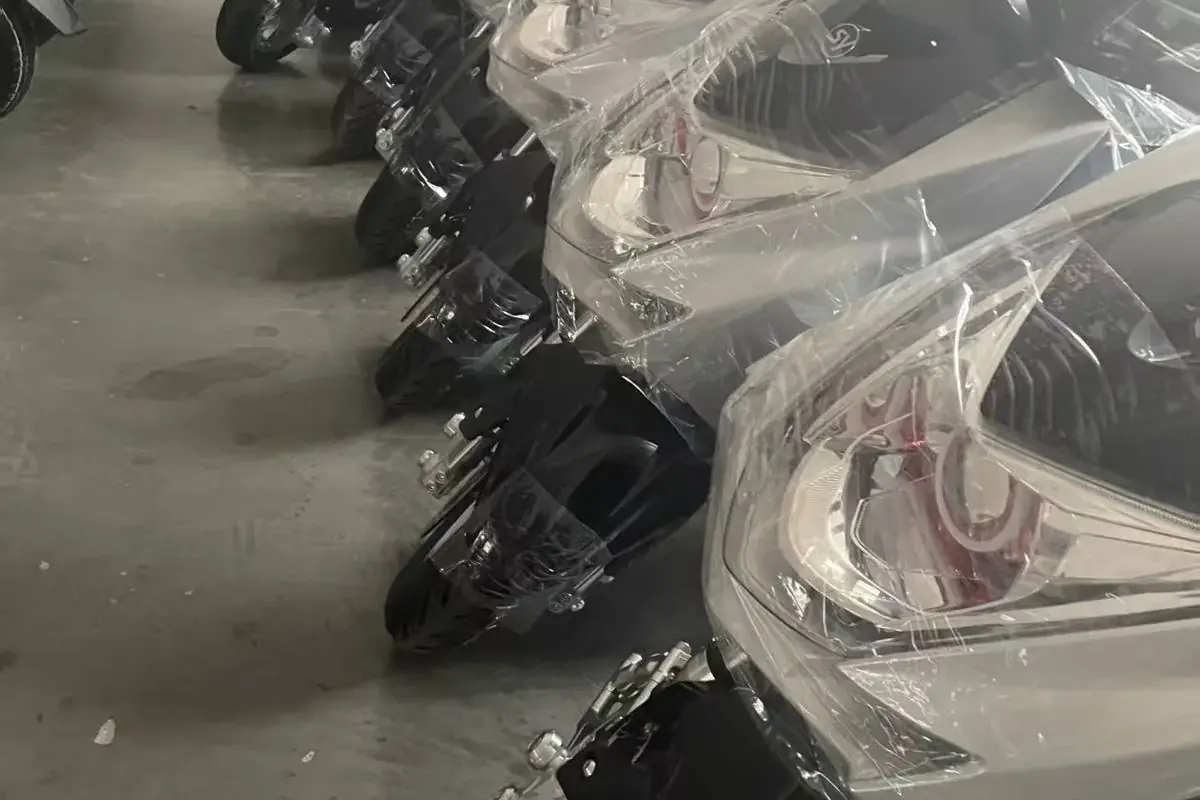 Rows of finished Aitose electric motorcycles in stock at the company warehouse